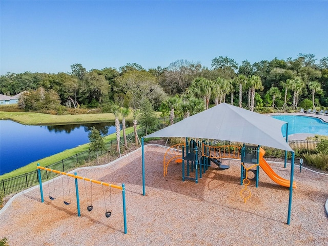 view of jungle gym with a water view