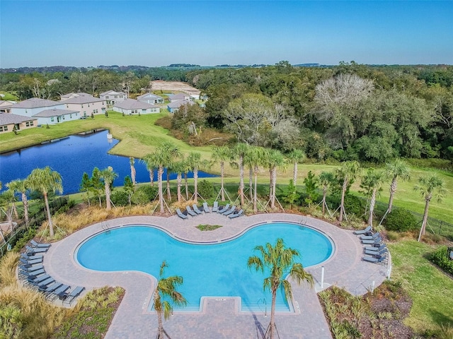 view of swimming pool featuring a water view