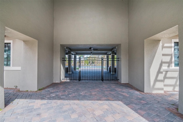 property entrance featuring ceiling fan and a patio