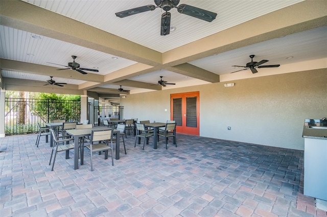 view of patio featuring ceiling fan