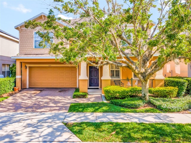 view of front of property with a garage