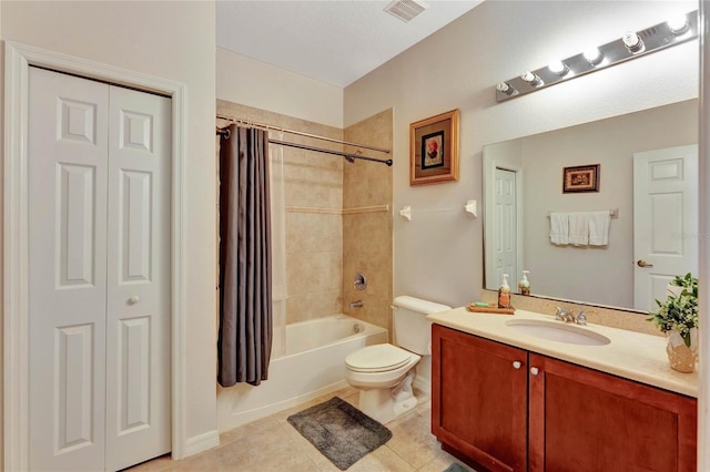 full bathroom with tile patterned floors, shower / bath combination with curtain, toilet, and vanity