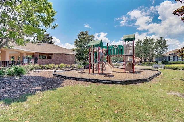 view of play area featuring a lawn