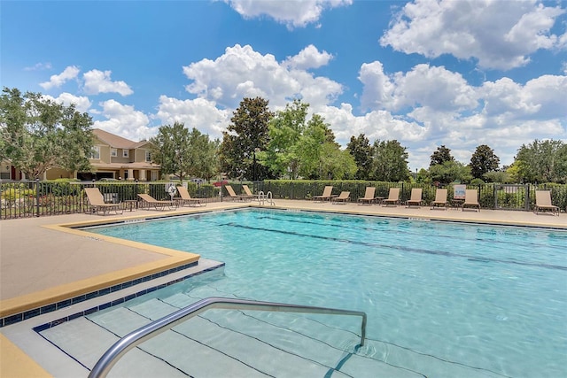 view of swimming pool featuring a patio area