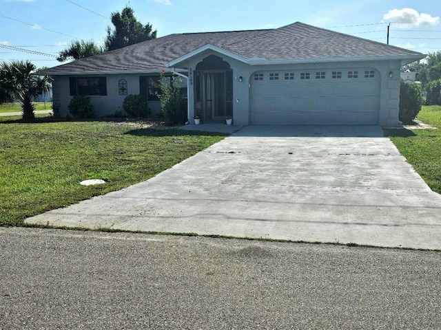 single story home with a front yard and a garage