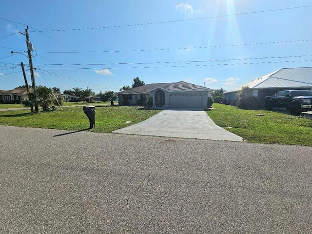 ranch-style house featuring a front lawn and a garage