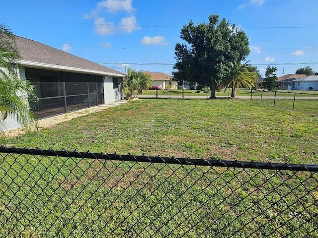 view of yard featuring a sunroom