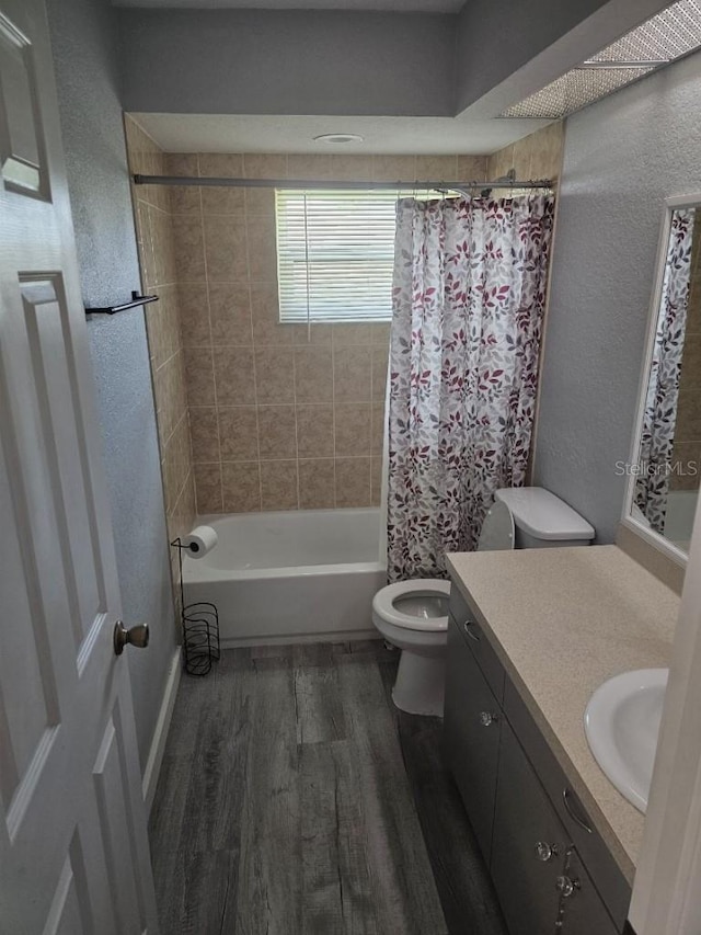 full bathroom with shower / bath combination with curtain, vanity, toilet, and wood-type flooring