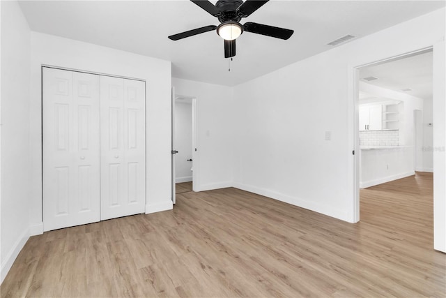 unfurnished bedroom featuring a closet, ceiling fan, and light hardwood / wood-style floors