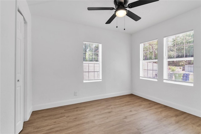 spare room featuring ceiling fan and light hardwood / wood-style floors