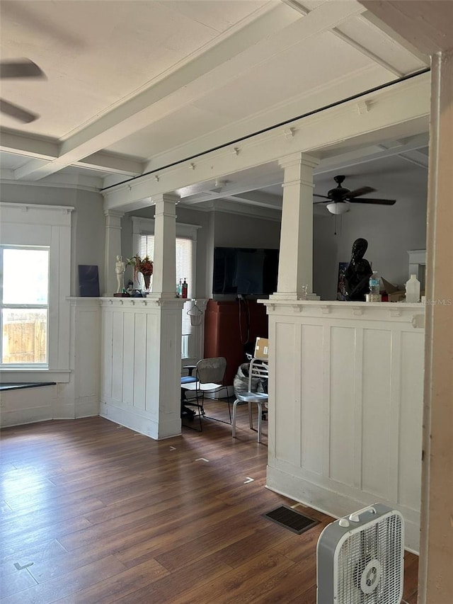 interior space with beam ceiling, ceiling fan, hardwood / wood-style flooring, and decorative columns