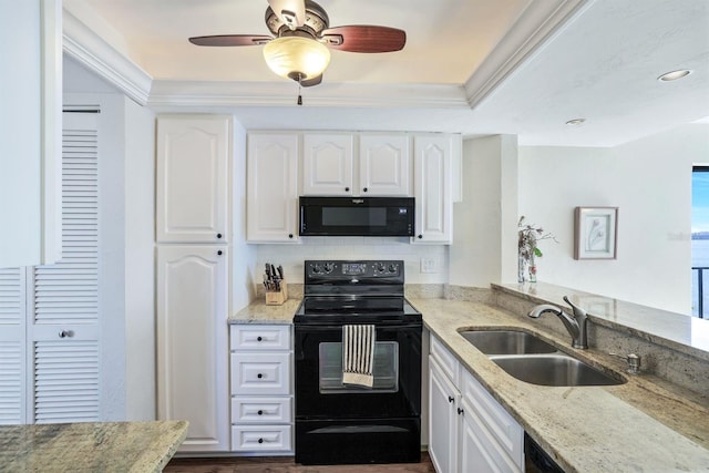 kitchen with white cabinets, ceiling fan, black appliances, and sink