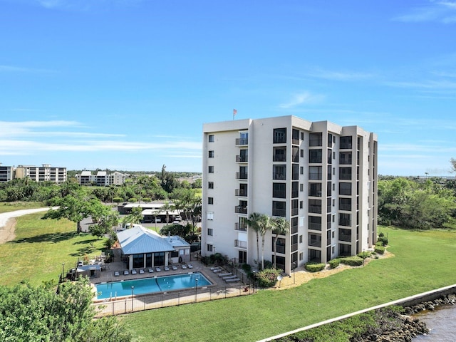 view of property featuring a community pool