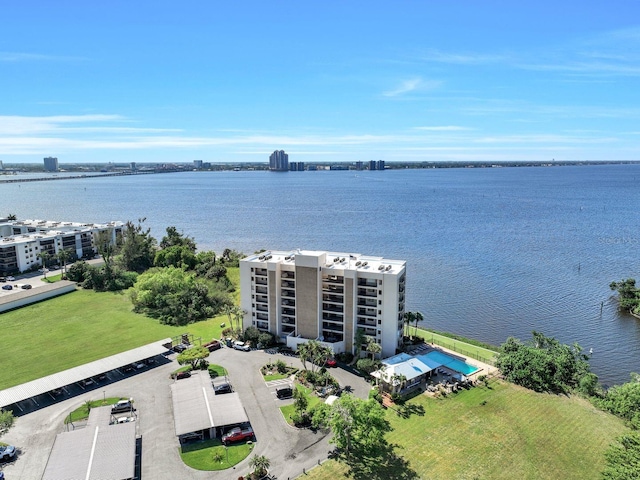 birds eye view of property with a water view