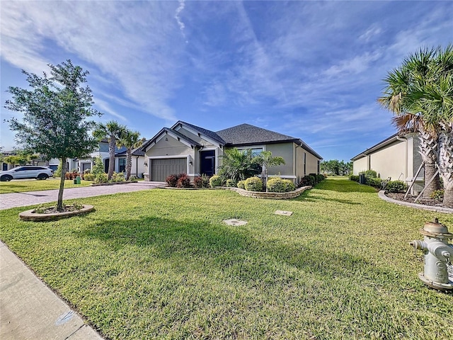 view of front facade with a garage and a front yard