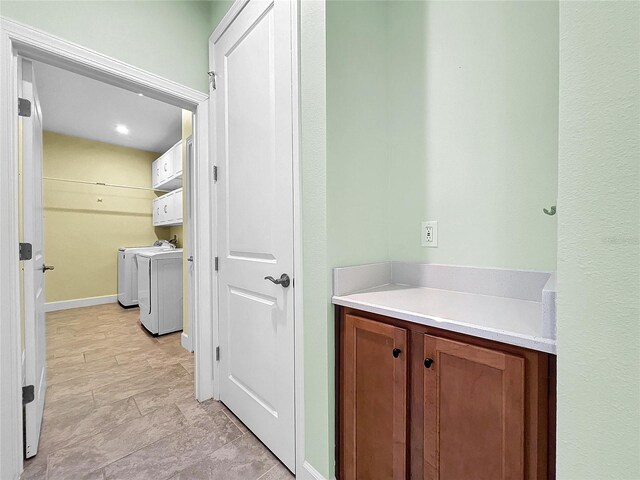 interior space with washer and dryer and tile patterned floors