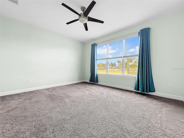 carpeted empty room featuring ceiling fan