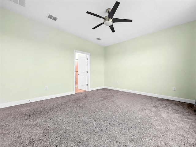 empty room with ceiling fan and carpet