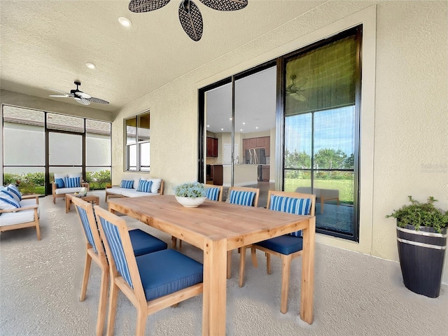 sunroom with ceiling fan and a healthy amount of sunlight