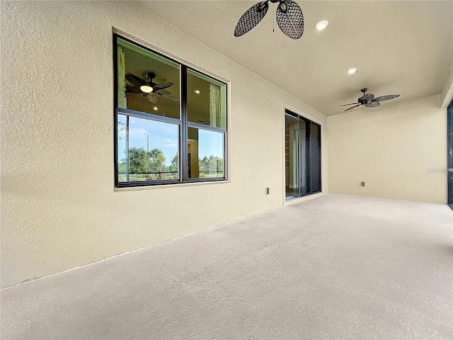 view of patio featuring ceiling fan