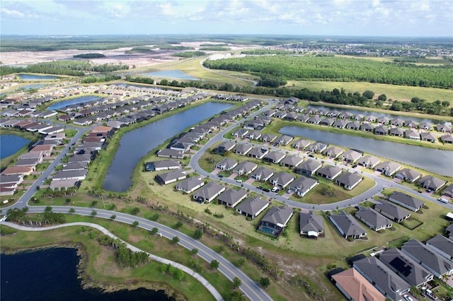 bird's eye view featuring a water view and a residential view