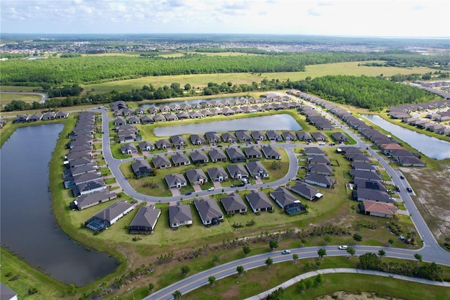 bird's eye view featuring a residential view and a water view