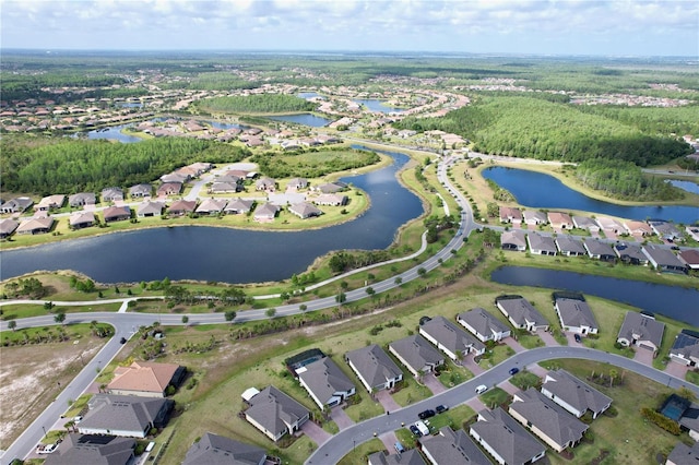 birds eye view of property featuring a water view and a residential view