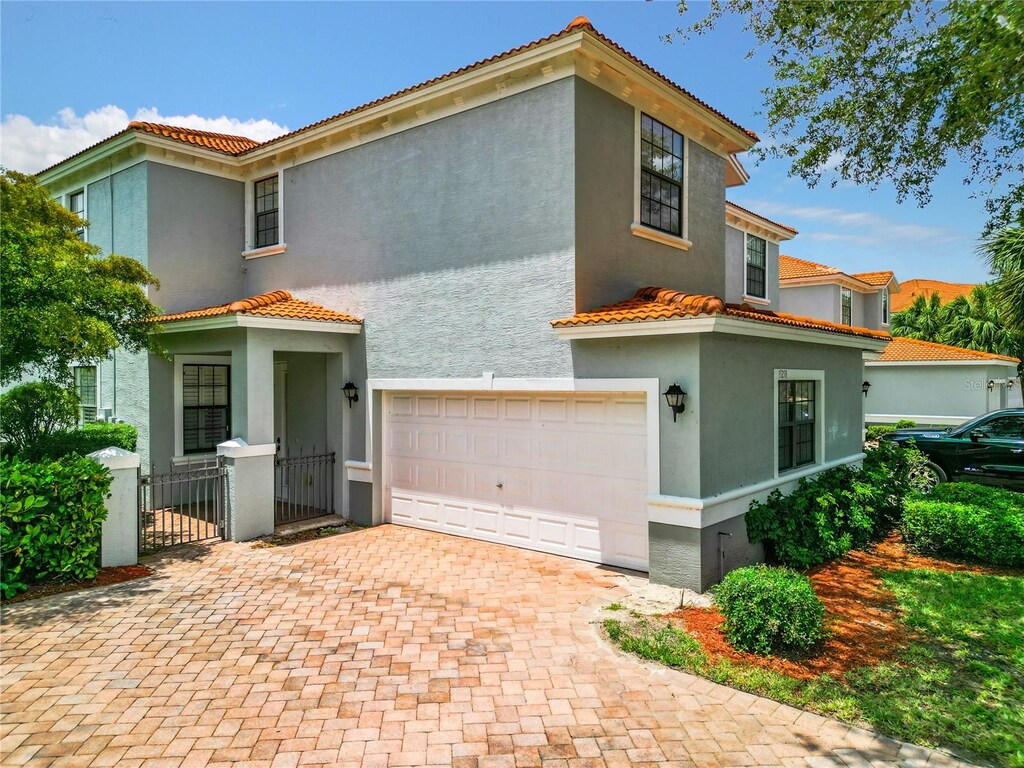 mediterranean / spanish-style house featuring a garage