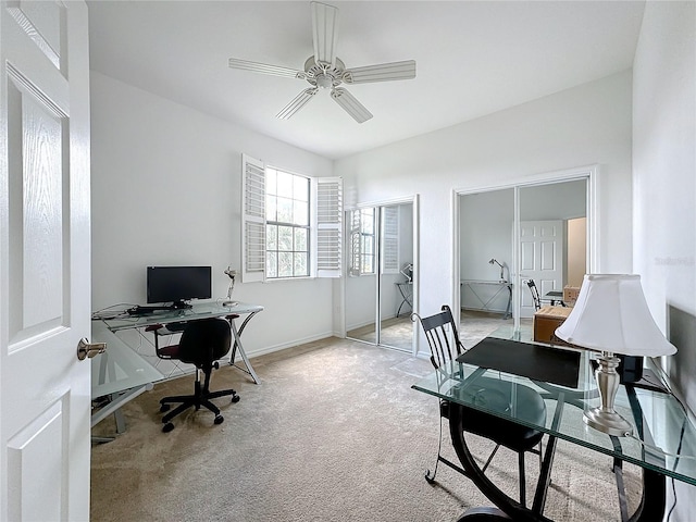 carpeted office with ceiling fan