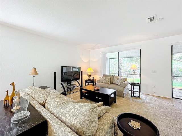 carpeted living room featuring a wealth of natural light