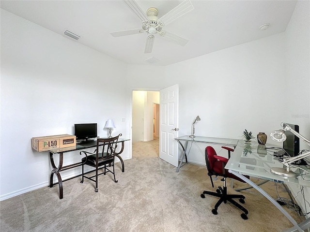 carpeted home office with ceiling fan