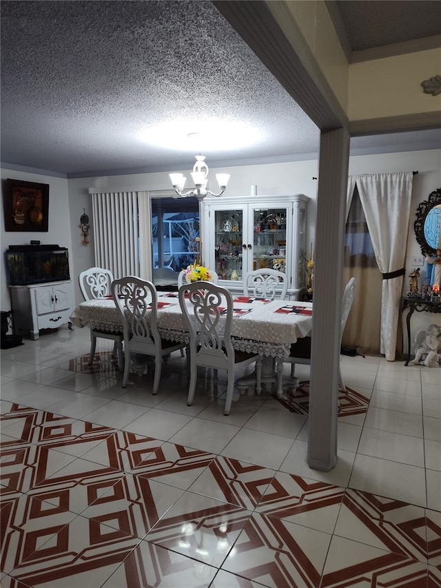 dining space with tile patterned floors, a textured ceiling, and a notable chandelier