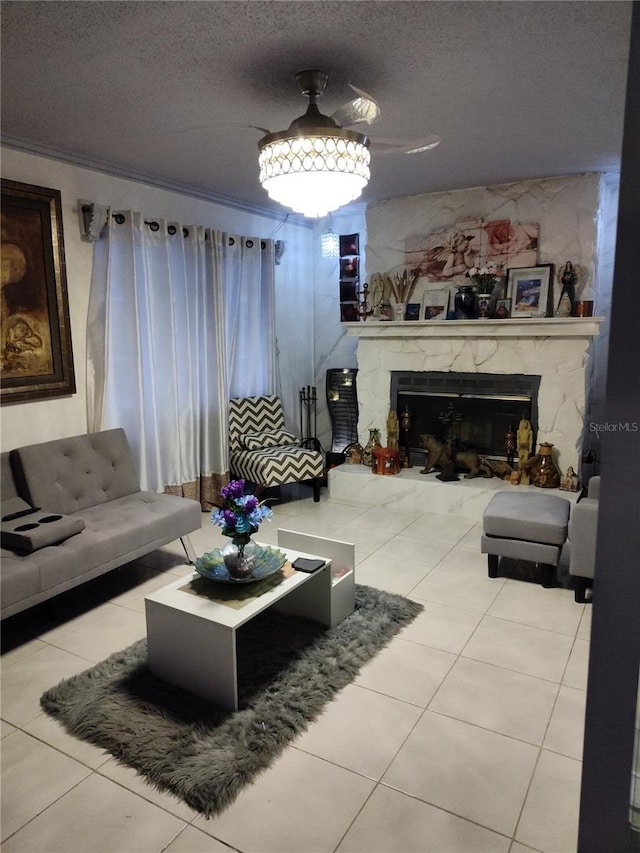 living room with a fireplace, a textured ceiling, and light tile patterned flooring