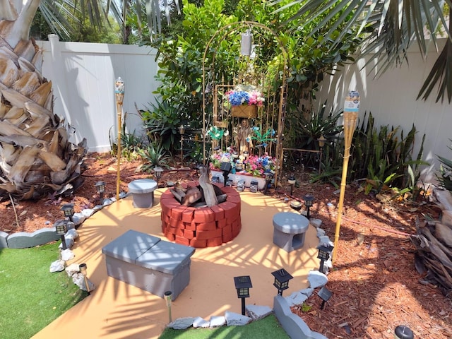 view of yard with a patio and an outdoor fire pit