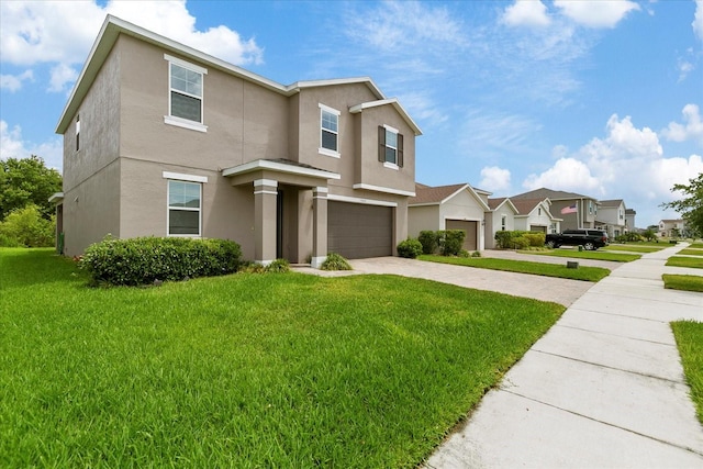 view of front of home with a front lawn and a garage