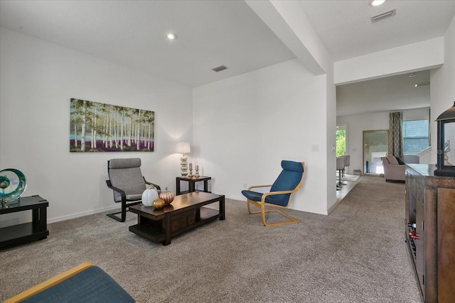 living area featuring carpet flooring