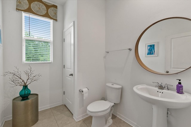 bathroom with tile flooring and toilet