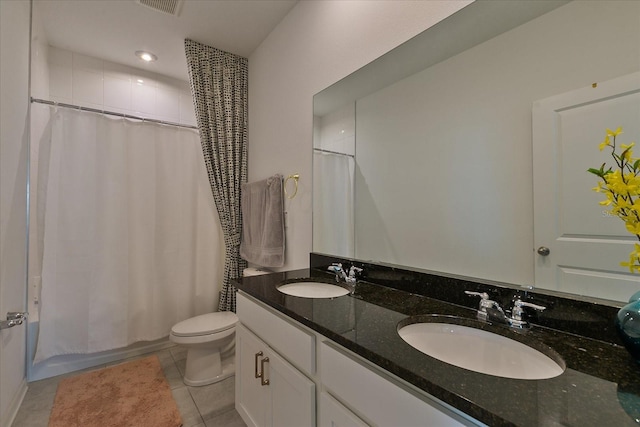 full bathroom with tile floors, toilet, double vanity, and shower / bath combo with shower curtain