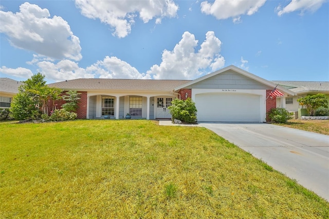 ranch-style home with a garage and a front yard