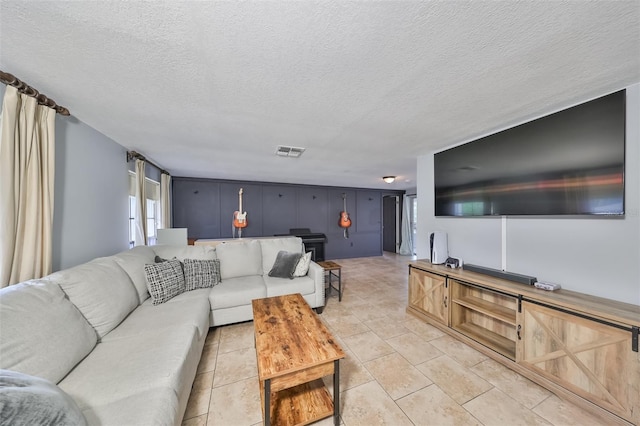 tiled living room with a textured ceiling