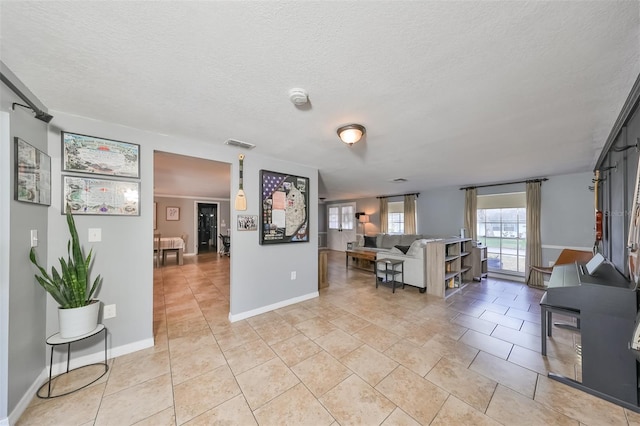 living room featuring tile patterned floors and a textured ceiling