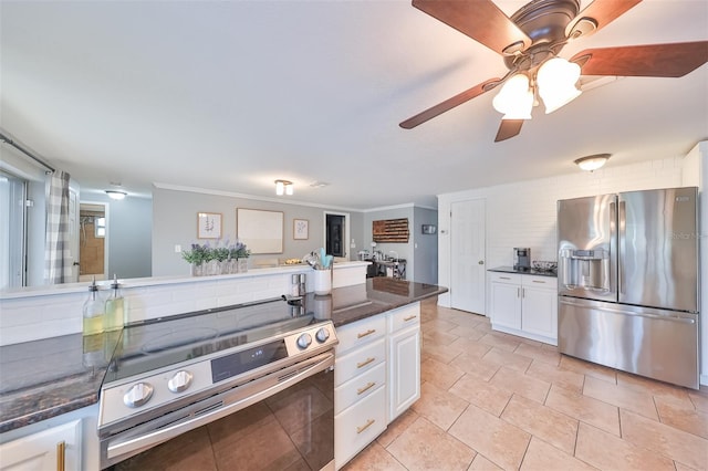 kitchen featuring light tile patterned flooring, white cabinetry, backsplash, ceiling fan, and stainless steel appliances