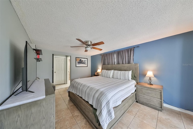 tiled bedroom featuring a textured ceiling and ceiling fan