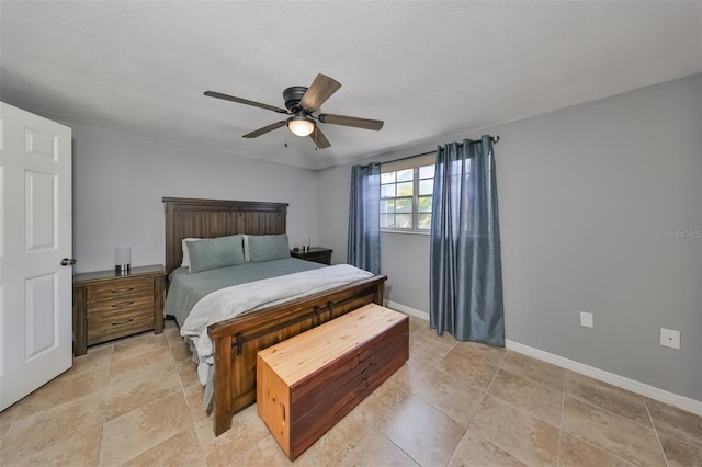 tiled bedroom with ceiling fan