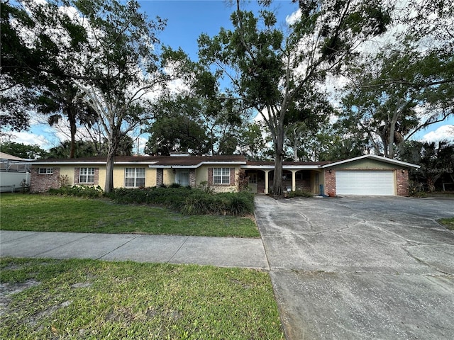 ranch-style house with a front yard and a garage