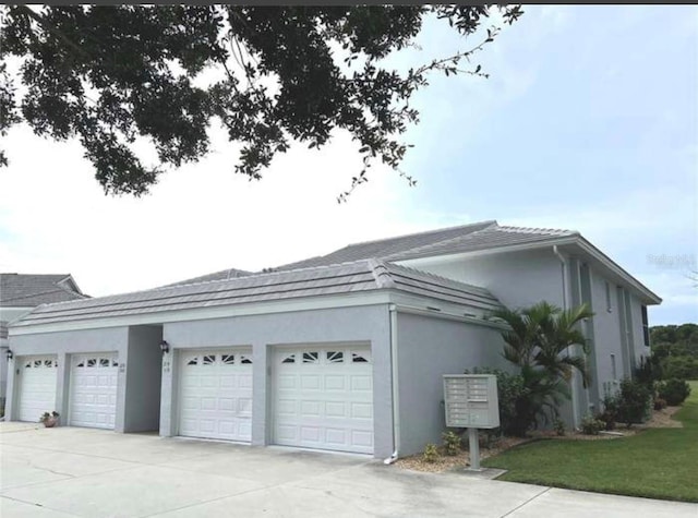 view of property exterior with a garage