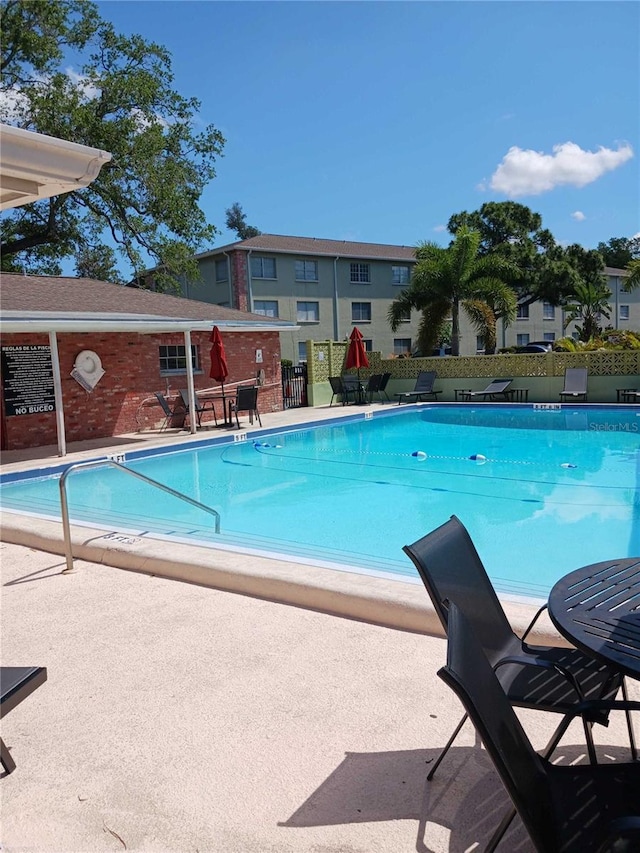 view of swimming pool featuring a patio area