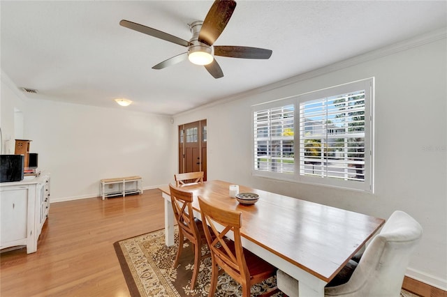 dining area featuring light hardwood / wood-style flooring, ceiling fan, and ornamental molding