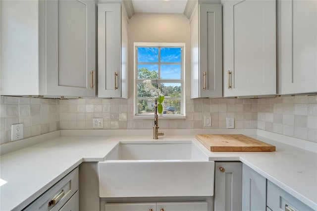 kitchen with sink and tasteful backsplash