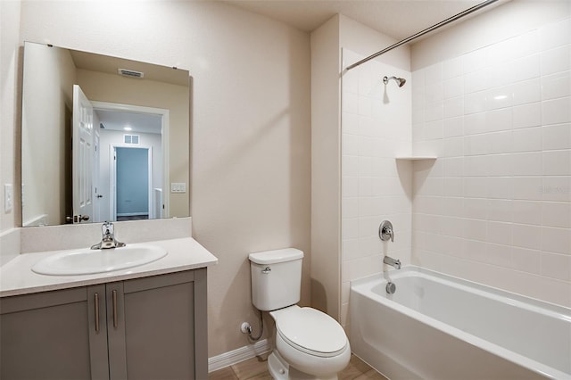 full bathroom with vanity, toilet, and tiled shower / bath combo